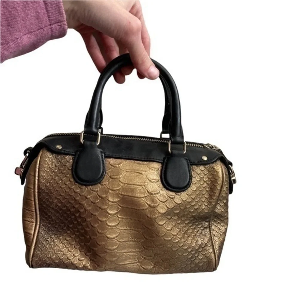 Coach gold embossed leather mini barrel bag